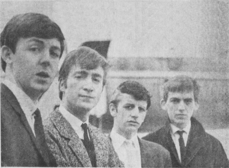 Paul, John, Ringo and George at Speke Airport, ready to go to London. Ringo still has his grey streak, and George a black eye