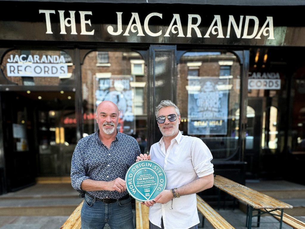 raham Stanley (right) of The Jacaranda accepts the World Origin Site Plaque to commemorate The Beatles appearance as John, Paul, George, Stuart and Pete, before they headed to Hamburg